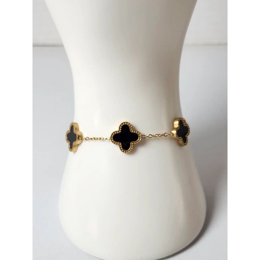 Gold Tone over stainless steel black clover bracelet